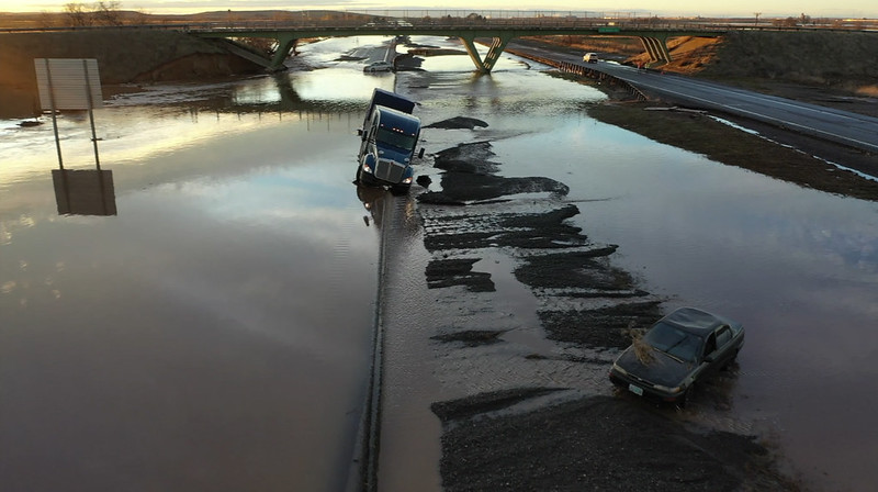 1-84 covered in water with cars stranded in the flood