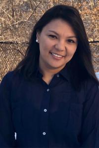 Picture of a woman with long, dark hair smiling