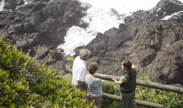 Field Ranger talking with Visitors at Devils Churn, Cape Perpetua, Siuslaw National Forest. USDA Forest Service photo. 