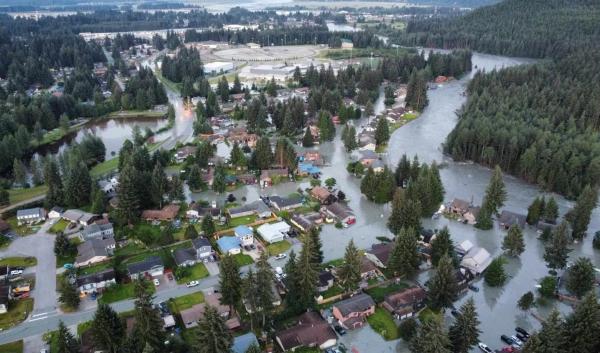 Flooding from a glacial lake outburst flood in a neighborhood adjacent to the Mendenhall River.